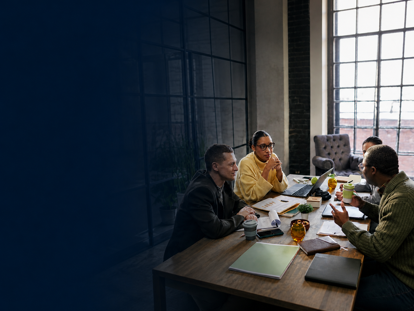 Employer and benefit advisors reviewing plan documents together